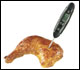 Photo of instant-read thermometer in chicken leg/thigh quarter